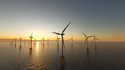 Offshore Wind Farm Turbines Spinning at Sunset