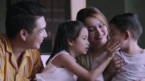 Happy Family Togetherness: Smiling and Talking at Home