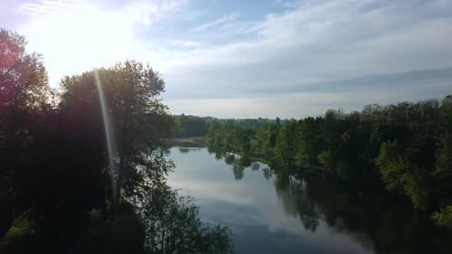 Aerial Drone View Flight Over Mirror Smooth Surface of River and Trees