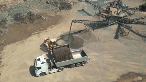 Aerial View of Heavy Machinery in a Quarry