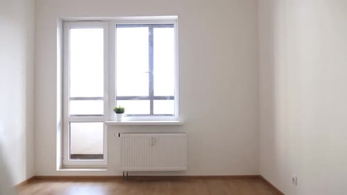 Interior of Empty Unfurnished Room with Walls Window and Radiator