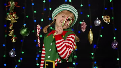 Cute Child Poses with Candy Cane at Christmas