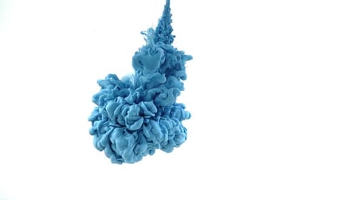 Blue Paint Spreading in Water on White Background