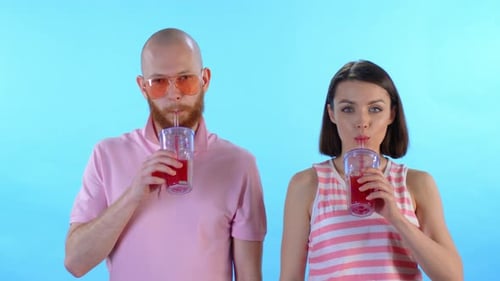 Young Adults Drinking Colorful Drinks Together