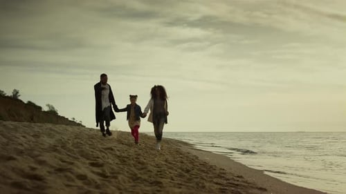 Family Hold Hands Beach By Sunset Sea