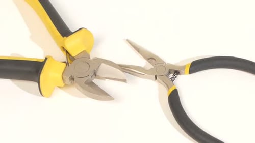 Needle-nose Pliers and Mini Cutters on White, Rotation, Close Up