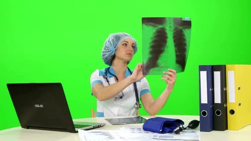 Doctor Analyzing X-Ray in Office Setting