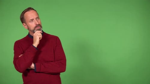 A Middleaged Caucasian Man Thinks About Something and Walks Back and Forth Green Screen
