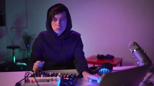 Handsome Man DJ Playing Music at Home Recording Studio Workshop, Student Learns To Write Creative