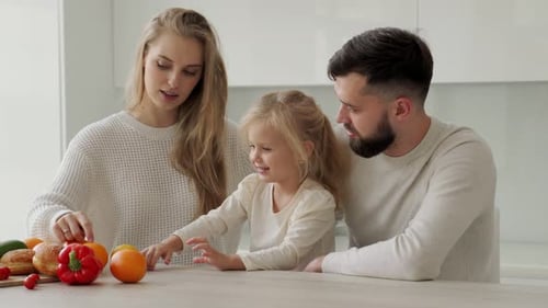 Happy Family Cooking Together in the Kitchen