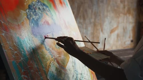 Woman Painting on Canvas in Studio
