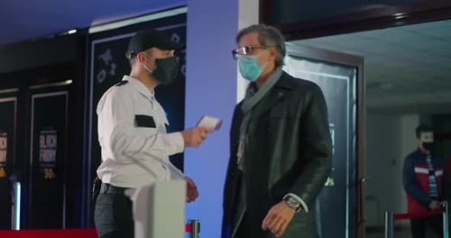 Guard Controlling Customers During Pandemic in Mall