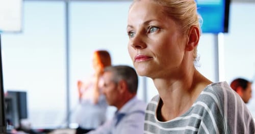 Woman Typing at Computer in Modern Office