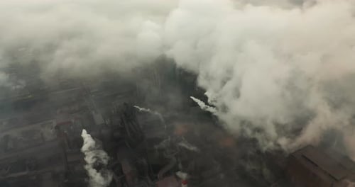 Aerial View. Emission To Atmosphere From Industrial Pipes. Smokestack Pipes Shooted with Drone