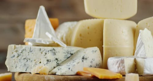 Cheese Assortment on Wooden Cutting Board, Close Up