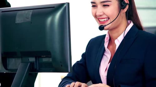 Business People Wearing Headset Working in Office