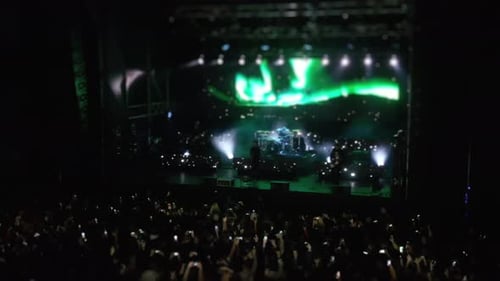 Crowd Enjoys Vibrant Concert with Stage Lighting