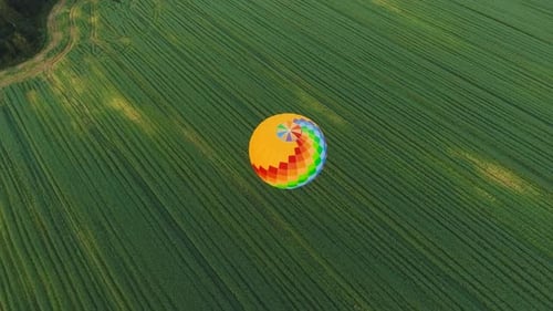 Hot Air Balloon in the Sky Over a Field
