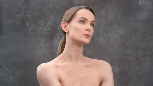 Beautiful Woman Posing with Bare Shoulders in Studio