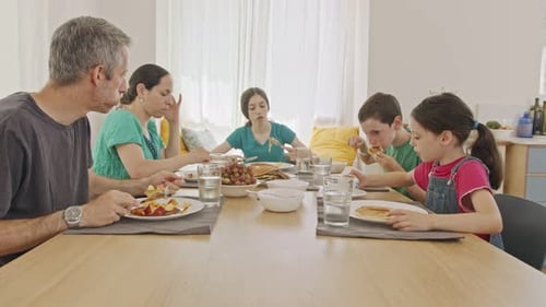 Family Eating Breakfast Together at Home