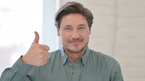 Man Giving Thumbs Up in Bright Daylight