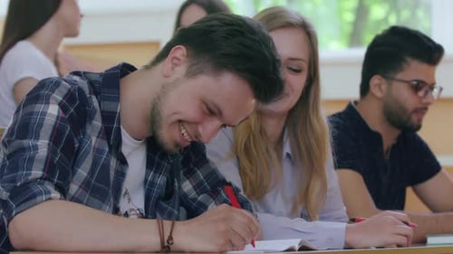 Enthusiastic Students Laughing and Learning in Class