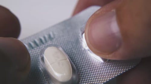 Close Up of Pill Being Removed From Blister