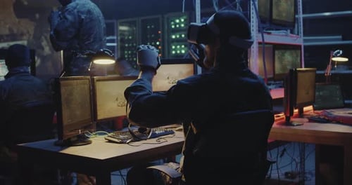 Man Using VR and Robotic Hands in Lab