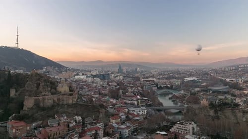 Beautyful cityscape of capital of Georgia. Time lapse shot of Tbilisi city at sunset.