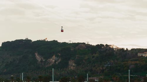 Barcelona Port Vell Cable Car Cabins Leaving Torre Jaume I in Barcelona Spain