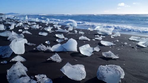 Ice Fragments on Black Sand Beach in Iceland