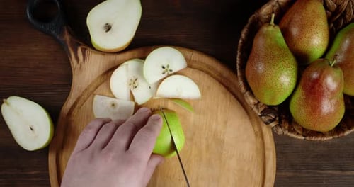 Man's Hand Crushed with a Knife Fresh Pear