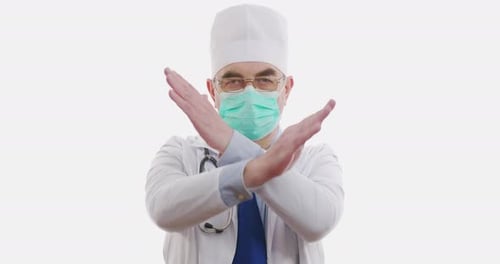 Medical Worker or Doctor Showing Stop Sign on Hospital. Isolated on White. Closeup.