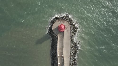 Top View Of People Walking Around The Poolbeg Lighthouse At The Mouth Of River Liffey Near Poolbeg,