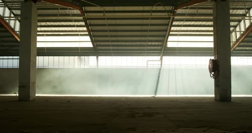 An empty warehouse with smoke grenade