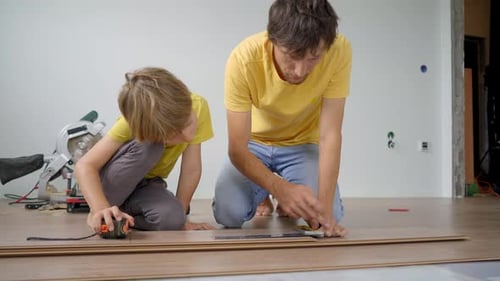Father and Son Install Flooring Together