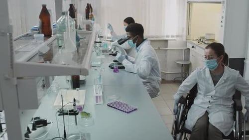 Diverse Scientists Conducting Research in Bright Laboratory
