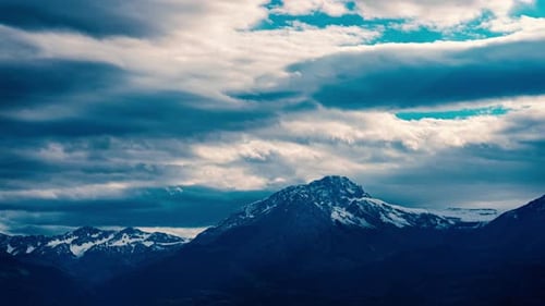 Snowy Mountains and Dramatic Sky