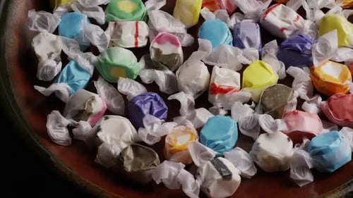 Bowl of Colorful Wrapped Taffy Candies