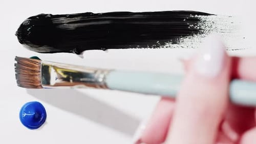 Brush Drawing with Colorful Paint Closeup Black Green and Blue Colours Art Concept
