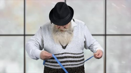 Man Measures Waist with Blue Tape Measure
