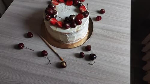 Cake Decorated with Strawberries and Cherries