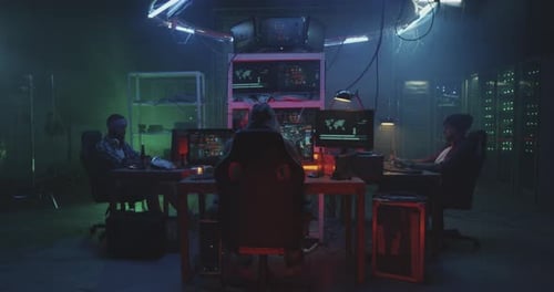 Hackers Working in Futuristic Dark Server Room, Panic