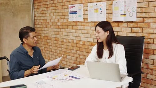 Collaborative Meeting at Office Between Man and Woman