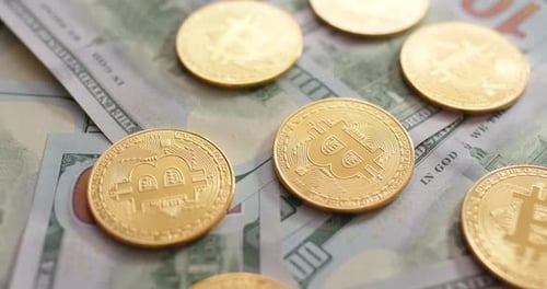 Gold Bitcoins Piled on US Currency