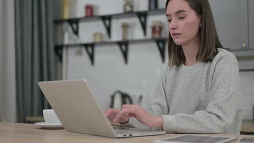 Hardworking Young Woman Closing Laptop and Going Away