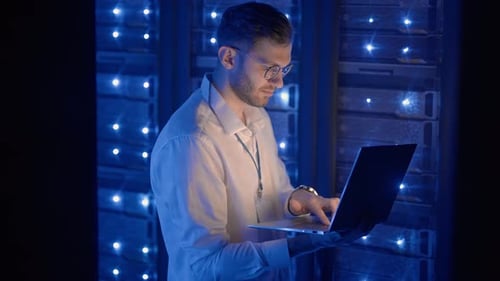 Data Center IT Specialists Coworking in Secure Server Room of Cyberspace