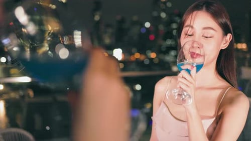 Young asian woman with sparklers is dancing and celebrating a new year