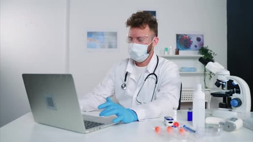 Male Employee of Medical Research Laboratory is Working in Office Filling Test Result in Database