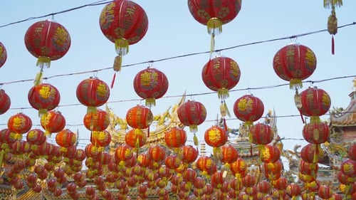 Red chinese lanterns hanging on wire outdoor lamps in temple of China Town decoration